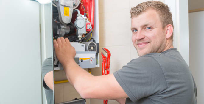 Technician repairing Gas Furnace