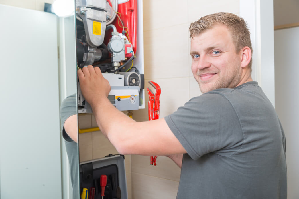 Technician repairing Gas Furnace